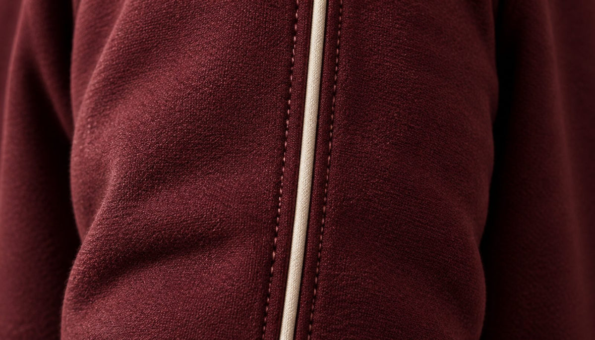 Close-up of the thin piping running down the sleeve.
